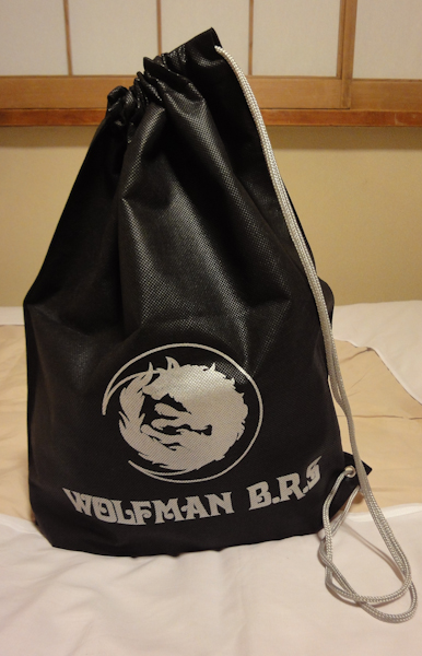 a drawstring bag with a wolf logo and Wolfman brs text